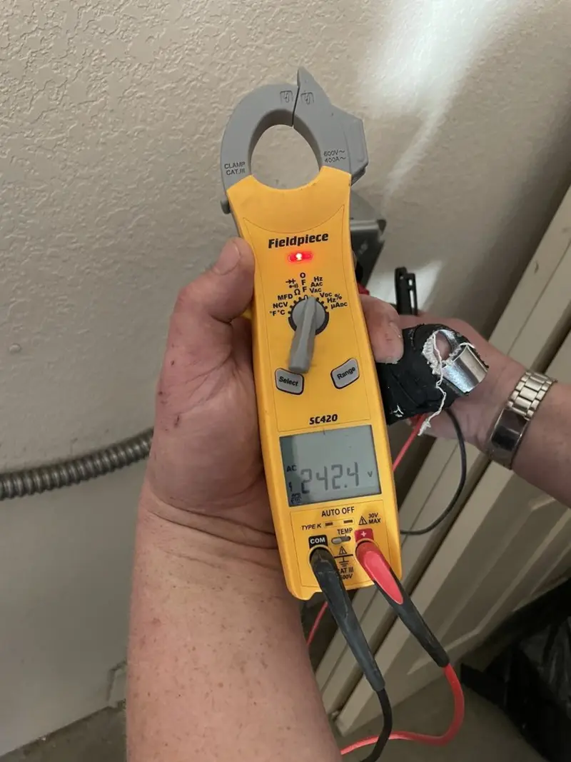 Voltage testing with clamp meter during Recessed Lighting Installation in Tobyhanna